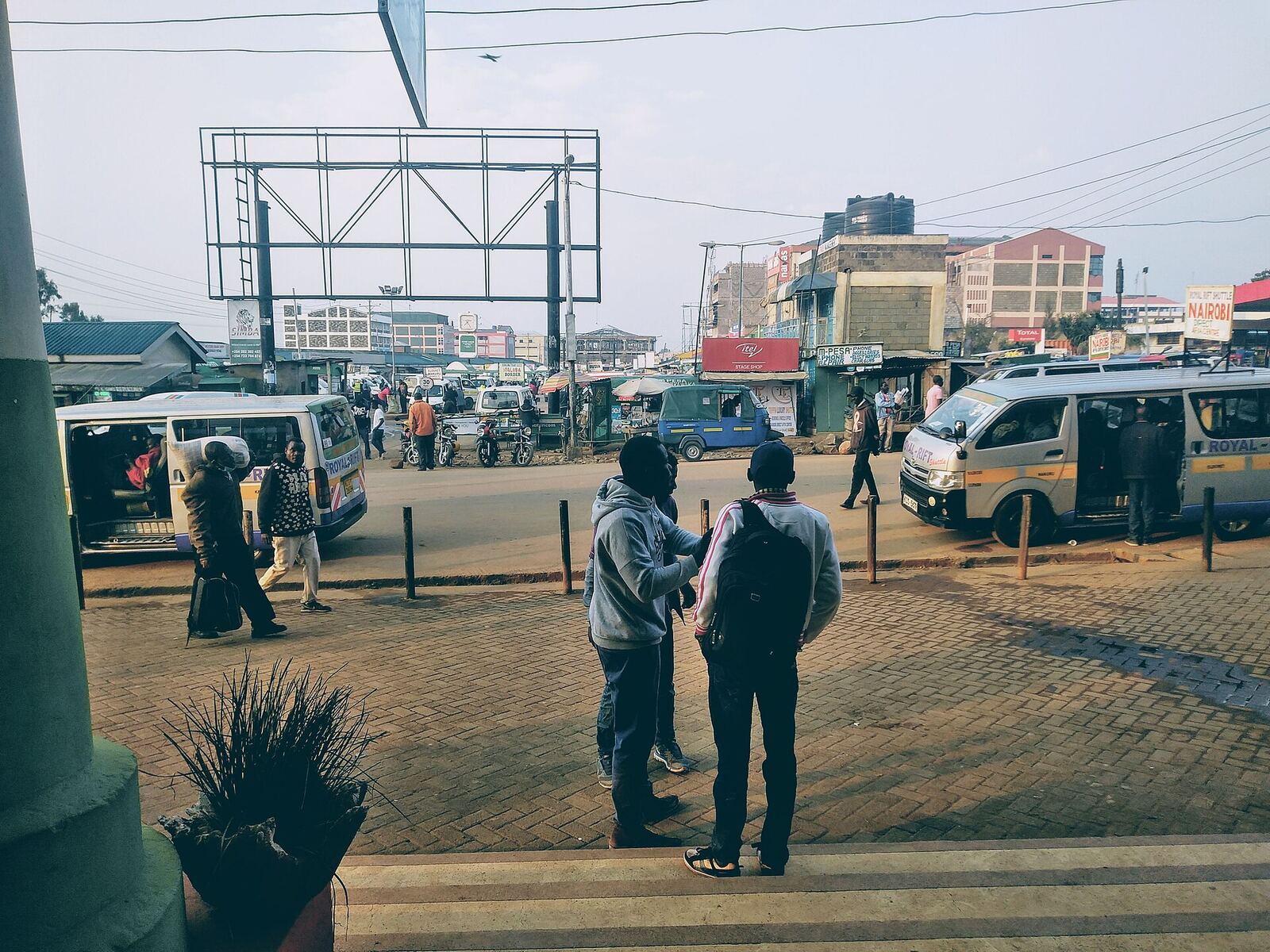 Matatus and travellers at the Bungoma bus park